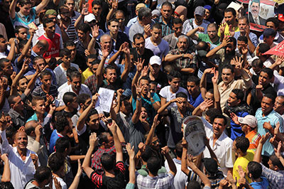 Supporters of Egypt's ousted President Mohammed Morsi protest in Cairo on August 30. Amid stark political polarization and street violence, safety deteriorated dramatically for journalists in Egypt.(AP/Mohammed Abu Zaid)