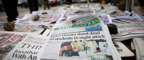 A newspaper displayed in the Ikoyi district of Lagos on September 30, 2013, tells of a deadly attack on a college in northeast Nigeria by suspected Boko Haram militants. Coverage of the group can be sensitive in Nigeria. (Reuters/Akintunde Akinleye)