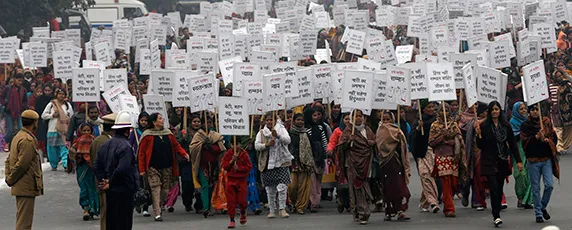 Women march for justice and security in New Delhi on January 2, 2013, following the funeral of a student who died after being gang-raped. (Reuters/Adnan Abidi)