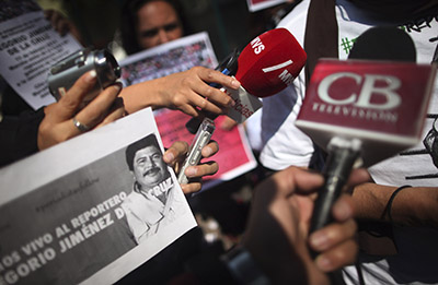 Mexican journalists speak in a news conference, protesting the abduction and murder of journalist Gregorio Jiménez de la Cruz. (Reuters/Edgard Garrido)