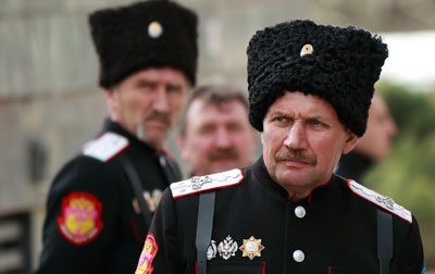 Cossacks stand guard near the Crimean parliament building in Simferopol, March 6. (Reuters/David Mdzinarishvili)