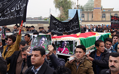 The funeral for Kurdish journalist Kawa Garmyane, who was killed in December 2013. (AFP/Shwan Mohammed)
