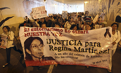 Journalists protest the one-year anniversary of the murder of journalist Regina Martínez Pérez. Anti-press attacks are so common that Mexican authorities passed a bill authorizing federal authorities to prosecute crimes against journalists. (AP/Felix Marquez)