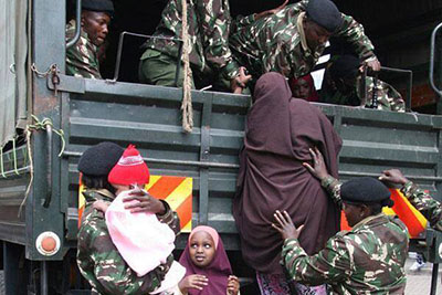 Somali families are boarded onto lorries from Eastleigh, Nairobi, and sent to one of two refugee camps. (Mohamed Adow)