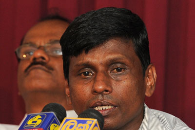 Sunil Jayasekera, convener of the Sri Lankan Free Media Movement, talks to journalists in Colombo in June. (AFP/Lakruwan Wanniarachchi)