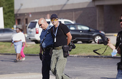 Police in Ferguson, Missouri, arrest Scott Olson, a photographer for Getty Images. (Reuters/Joshua Lott)