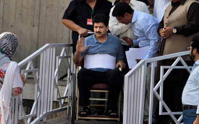 Pakistani journalist Hamid Mir was hit by six bullets in April and, more recently, a new round of threats. (AP/Anjum Naveed)