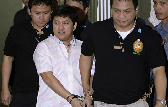 Andal Ampatuan Jr., center, is taken into court on charges of leading the attack on 58 people, including 32 journalists and media workers, in the 2009 Maguindanao massacre. (Reuters/Cheryl Ravelo)