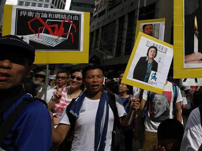 Protesters carry a placard of jailed journalist Gao Yu at a demonstration in Hong Kong in July. (Reuters/Bobby Yip)