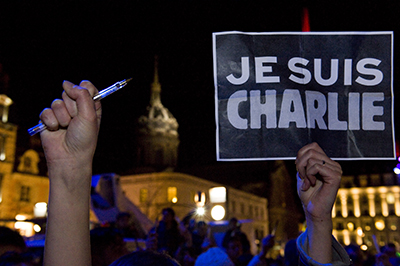 A vigil in France for victims of the Charlie Hebdo attack. In cities across the world, pens and signs reading I Am Charlie were held aloft in honor of those killed in the gun attack. (AFP/Thierry Zoccolan)