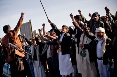 Houthi Yemenis chant slogans during a rally to show support for their comrades in Sana'a, Yemen, on Wednesday. (AP/Hani Mohammed)