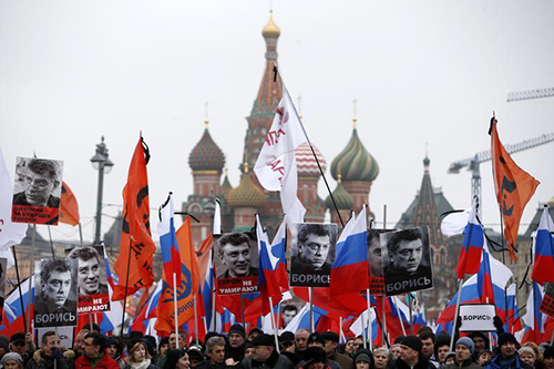 Signs that read 'I am not afraid' are carried at a march in Moscow in memory of Boris Nemtsov. His killing has been compared to the murders of critical journalists. (Reuters/Sergei Karpukhin)