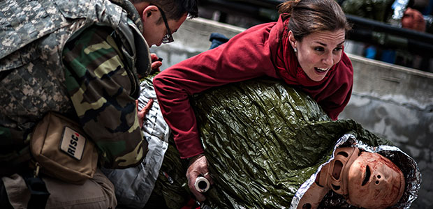 Journalists are trained in battlefield medicine by Reporters Instructed in Saving Colleagues, or RISC, in New York City. Mike Shum, left, and Holly Pickett prepare to move a training dummy simulating an injured person during a care-under-fire exercise. (AP/RISC, James Lawler Duggan)