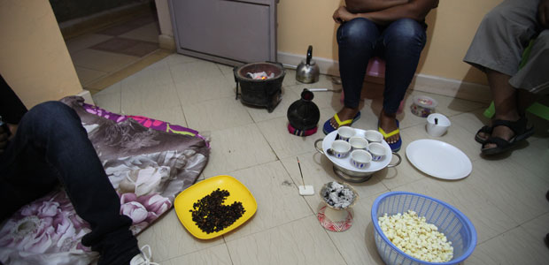 Exiled Ethiopian journalists perform a traditional coffee ceremony in a shared, cramped apartment in Nairobi. A wave of arrests prompted at least 30 Ethiopian journalists to flee into exile in 2014.  (CPJ/Nicole Schilit)