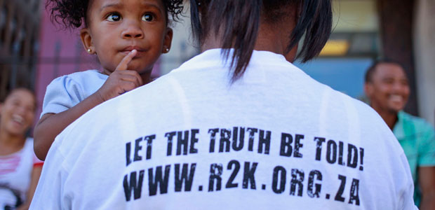 A woman from the Right2Know campaign protests with her child against the State Information Bill, which would enable the prosecution of whistleblowers, public advocates, and journalists who reveal corruption, in Cape Town on April 25, 2013. (AP/Schalk van Zuydam)
