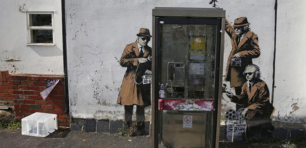 Graffiti attributed to the street artist Banksy is seen near the offices of Britain's eavesdropping agency, Government Communications Headquarters, or GCHQ, in Cheltenham, England, on April 16, 2014. (Reuters/Eddie Keogh)