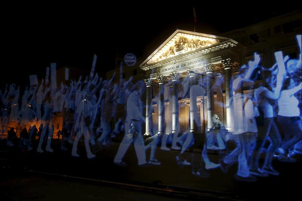 A hologram of protesters is projected outside parliament in Madrid on April 10 in opposition to Spain's restrictive 'gag law,' which bans rallies near government buildings and threatens fines for photographing police. (Reuters/Susana Vera)