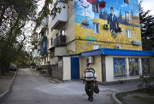 A mural in Sevastopol shows President Vladimir Putin in a Navy uniform. Crimea's press is struggling to survive after Russia illegally annexed the Ukrainian region. (AP/Alexander Zemlianichenko)