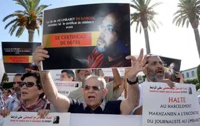 Moroccans take part in a demonstration to support French-Moroccan satirical journalist Ali Lmrabet on July 24 in front of the parliament in the Moroccan capital Rabat. (AFP/Fadel Senna)