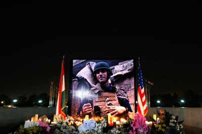 A photograph of James Foley is seen during a memorial service in Erbil in Iraqi Kurdistan on August 24, 2014. (AP/Marko Drobnjakovic)