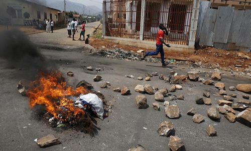 A Bujumbura road is blocked during unrest over elections in Burundi in July. Many Burundians, including journalists, have gone into exile to flee the violence. (Reuters/Mike Hutchings)