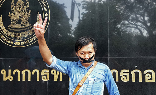 Pravit Rojanaphruk outside a military base in Bangkok in May 2014. The Thai journalist is being held in military detention. (AFP)