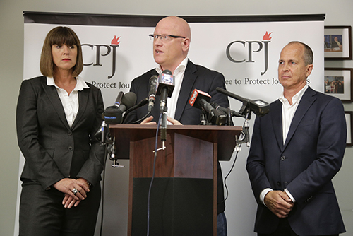 Dominic Kane, center, flanked by his Al-Jazeera colleagues Sue Turton, at left, and Peter Greste, at a press conference at CPJ's offices. All three have been convicted in absentia. (AP)