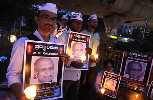 A vigil for rationalist scholar M.M. Kalburgi, who was shot dead earlier this year. Threats against writers and journalists from the rationalist school of thought are rising in India. (AP/Aijaz Rahi)