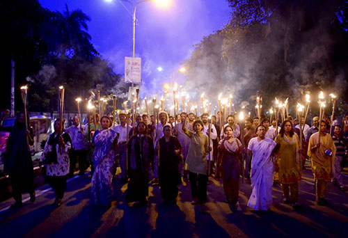 Bangladeshi protesters hold torches in a demonstration against the murder of Niloy Neel, the fourth blogger killed in the country this year. (AFP/Munir uz Zaman)