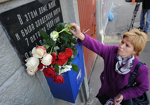 Flowers are left at the apartment of murdered journalist Anna Politkovskaya. Between 2000 and 2015, at least 26 journalists have been killed in direct relation for their work in Russia. (AFP/Natalia Kolesnikova)