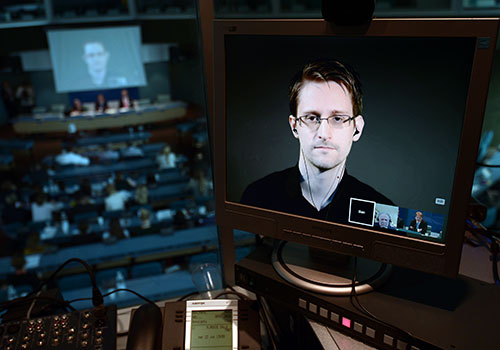 Former NSA contractor Edward Snowden appears via video link at the EU. Revelations of mass surveillance have had an impact on member states. (AFP/Frederick Florin)