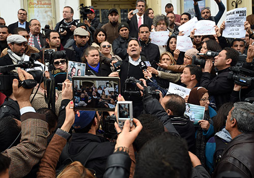 Neji Bhouri, president of the Tunisian Union of Journalists, speaks to members in January after the Islamic State claimed to have murdered two Tunisian journalists missing in Libya. (AFP/Fethi Belaid)