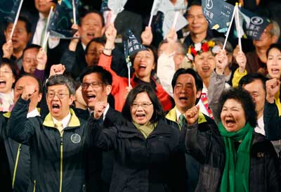 Tsai Ing-wen, center, declares victory in the presidential election in Taipei on January 16, 2016. (AP/Wally Santana)