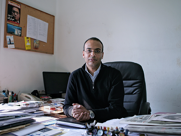 Hossam Bahgat sits at his desk in a December 7, 2011, file photo (AP/Sarah Rafea)