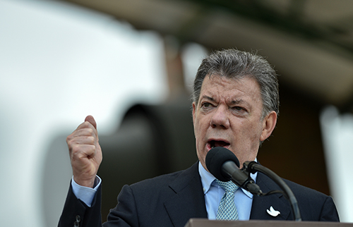 Since taking power President Santos, above, has introduced reforms to the intelligence sector but journalists and privacy groups have questioned their effectiveness. (AFP/Guillermo Legaria)