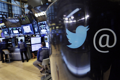 The Twitter logo is reflected on a pillar in the New York Stock Exchange. A CPJ poll of the site's users found many did not know how to secure their accounts. (AP/Richard Drew, File)