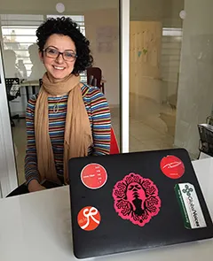 A sticker on a laptop belonging to 7iber's co-founder Lina Ejeilat shows all the site's domains that have been blocked by authorities. Each time, the news site switched to a new domain to try to protest the press law. (CPJ/Jason Stern)