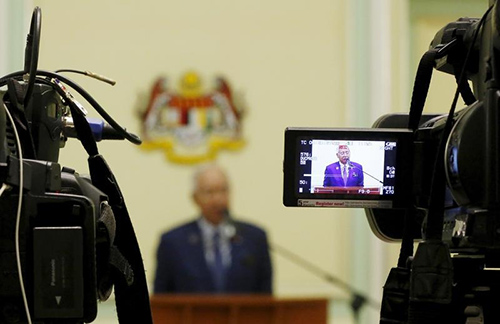 Malaysia's Prime Minister Najib Razak speaks to the press in September 2015. News outlets that critically covered allegations in the 1MDB scandal are facing censorship and pressure. (Reuters/Olivia Harris)