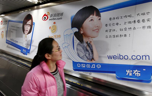 An advertisement for Weibo in Beijing. The Chinese microblogging site uses a large team of censors to monitor users' posts, a former employee says. (Reuters/China Daily)