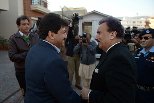 Hamid Mir, pictured with Pakistani Interior Minister Rehman Malik in 2012 after a bomb was found under the journalist's car, says he takes threats seriously. The Geo News anchor has also survived two shootings. (AFP/Farooq Naeem)