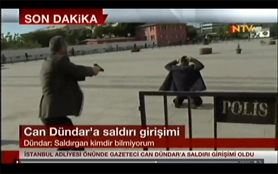 A screenshot from an online video feed of Turkey's NTV television station shows police detaining the man suspected of attempting to shoot Cumhuriyet journalist Can Dündar outside his trial in Istanbul, May 6, 2016.