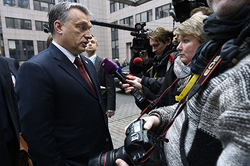 Hungary's Prime Minister, Viktor Orbán, talks to the press outside the EU leaders' summit in March. The country's poor press freedom record and policies on asylum seekers have been criticized by the U.N. (AFP/John Thys)