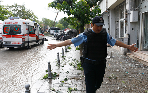 A policeman gestures after a bomb exploded in central Istanbul, killing at least 11 people, June 7, 2016 (Osman Orsal/Reuters)