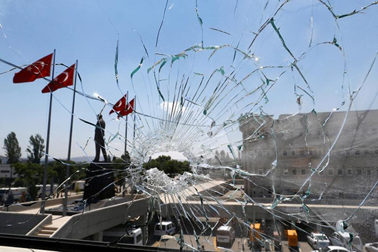 Turkey's capital is calm as seen through a broken window at Ankara police headquarters, July 18, 2016, days after soldiers launched a failed attempt at a coup. (Osman Orsal/Reuters)