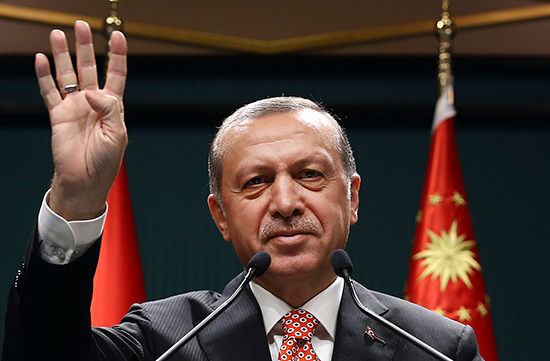 In this July 24, 2016, handout photo, Turkish President Recep Tayyip Erdoğan gives the Rabaa salute, a reference to Cairo's Rabaa al-Adawaya Square, where Egyptian soldiers and police in August 2013 killed hundreds of supporters of Egyptian President Mohammed Morsi protesting the military's ousting of the Egyptian president in July 2013. (Pool/AP)