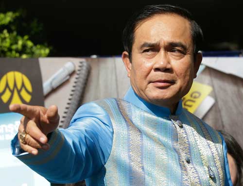 Thai Prime Minister Prayuth Chan-ocha arrives for a cabinet meeting in Bangkok on August 9, 2016. He has empowered a state media regulator to close news outlets without the right to appeal for reasons of national security. (AP/Sakchai Lalit)