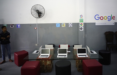 Laptops are laid out in the studio of Cuban artist Kcho as part of a Google tech initiative in the country. (AP/Ramon Espinosa)