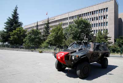 Members of police special forces keep watch from an armored vehicle in front of a courthouse in Ankara, Turkey, on July 18, 2016. (Reuters/Baz Ratner)