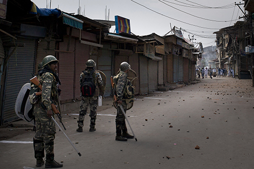 Indian security forces face protesters during unrest in Srinagar in September. Journalists are being caught in the crossfire during the recent unrest. (AP/Dar Yasin)