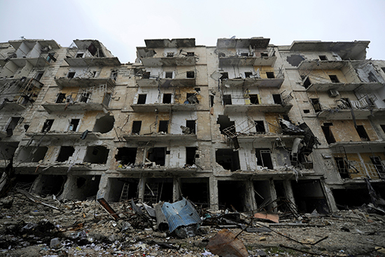 Damaged buildings are seen in the government-held Aleppo neighborhood of Al-Shaath during a media tour, December 13, 2016. (Reuters/Omar Sanadiki)